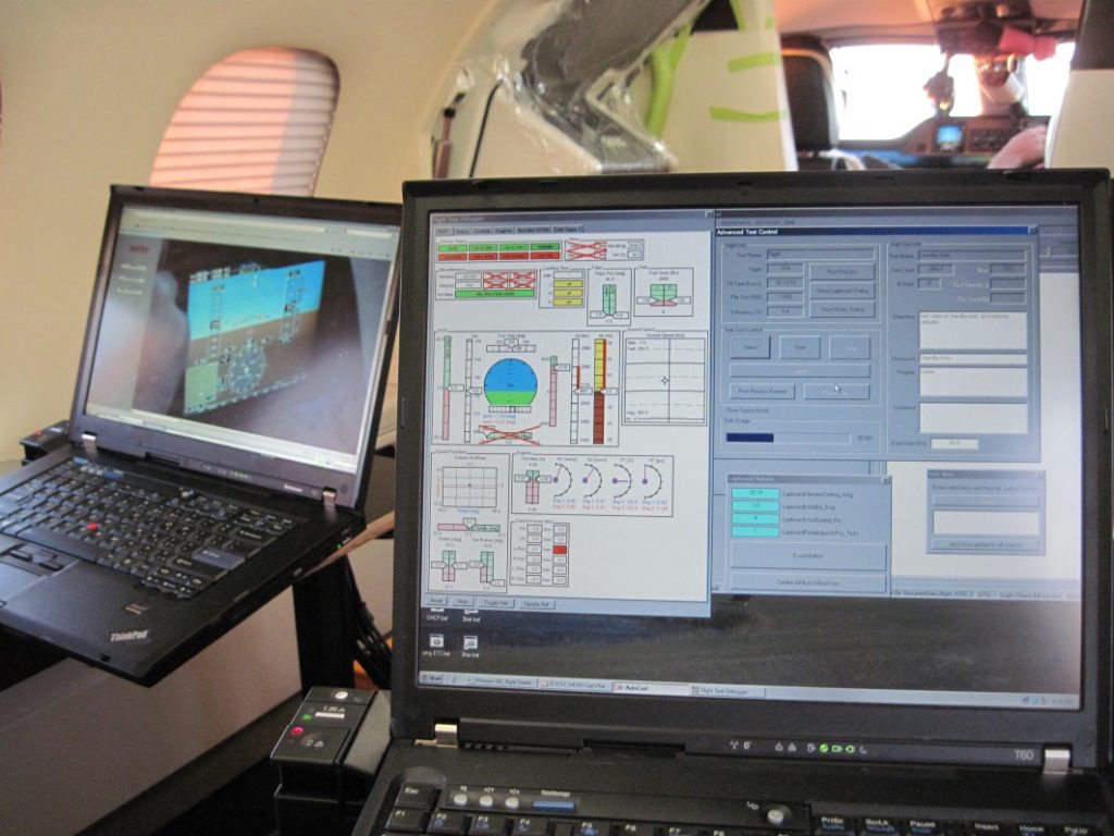 Figure 2: The flight test engineer's station with laptops to monitor flight parameters, cockpit video, and to control aspects of data recording